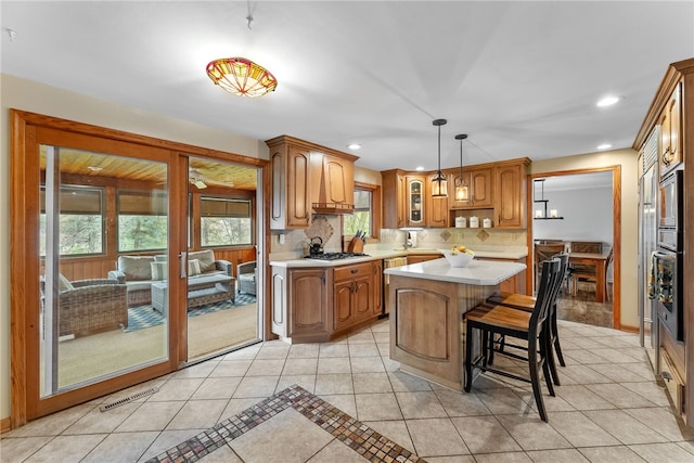 7104 Cresswyck Ct, Marshall, PA 15090 - kitchen with light countertops, light tile patterned floors, appliances with stainless steel finishes, tasteful backsplash, and brown cabinets