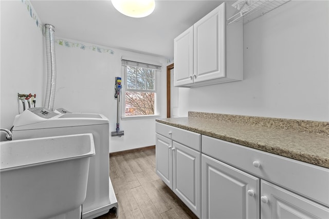 7104 Cresswyck Ct, Marshall, PA 15090 - washroom with washer and clothes dryer, dark wood-style flooring, cabinet space, and baseboards