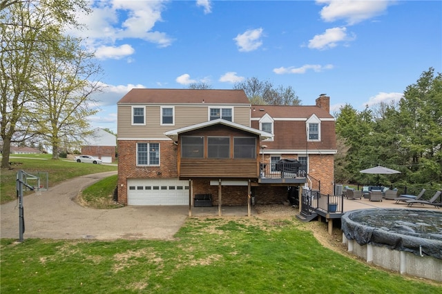 7104 Cresswyck Ct, Marshall, PA 15090 - back of house with a sunroom, a wooden deck, brick siding, an attached garage, and a chimney
