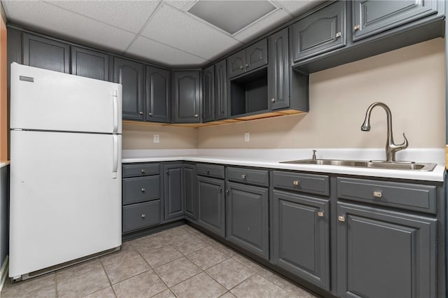 103 Cherokee Ct, Buffalo Twp But, PA 16229 - kitchen featuring freestanding refrigerator, a sink, gray cabinetry, light tile patterned floors, and light countertops