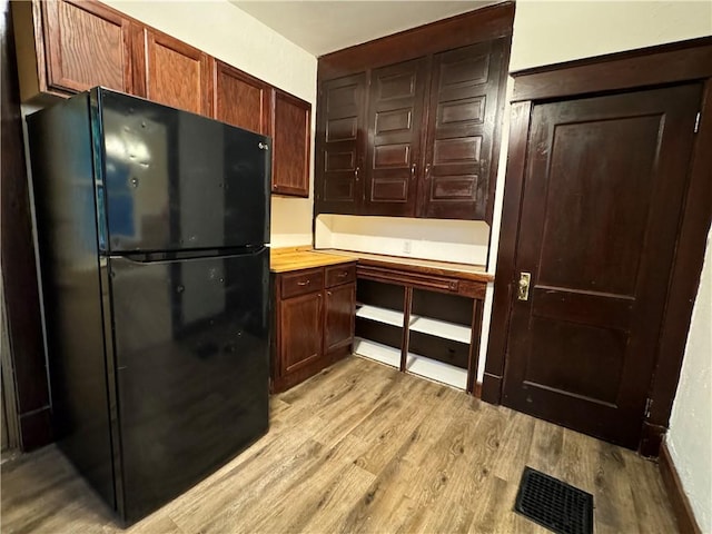 243 Oak St, City Of But Ne, PA 16001 - kitchen featuring freestanding refrigerator and light wood-style flooring