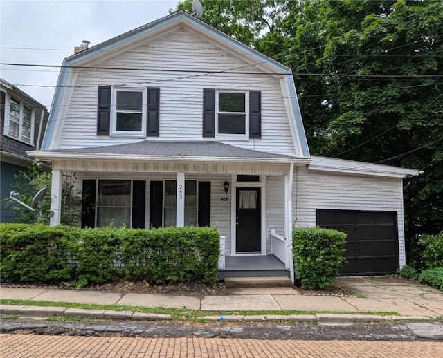 243 Oak St, City Of But Ne, PA 16001 - view of front of property featuring a gambrel roof, covered porch, an attached garage, and driveway