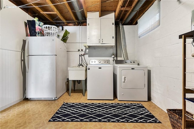 1050 Preston Dr N, Versailles, PA 15137 - laundry room with cabinet space, independent washer and dryer, and concrete block wall