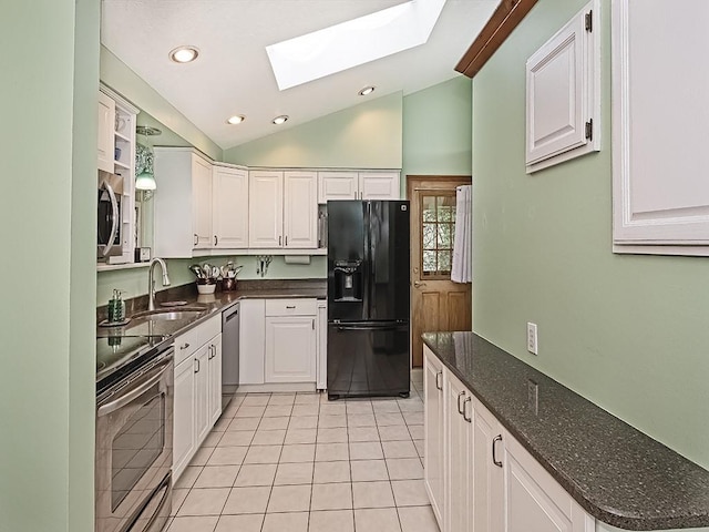 305 Ivy Dr, Pine Twp Nal, PA 15044 - kitchen with appliances with stainless steel finishes, a sink, a skylight, lofted ceiling, and white cabinetry