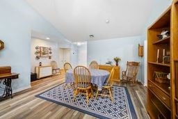 1011 Sunnyfield Ct, Penn Twp Wml, PA 15636 - dining area with wood finished floors and lofted ceiling