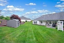 1011 Sunnyfield Ct, Penn Twp Wml, PA 15636 - view of green lawn featuring a patio