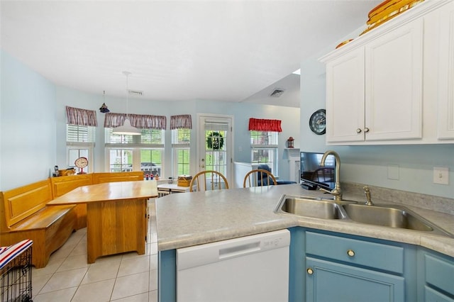 1011 Sunnyfield Ct, Penn Twp Wml, PA 15636 - kitchen featuring dishwasher, a peninsula, light tile patterned floors, white cabinetry, and blue cabinetry