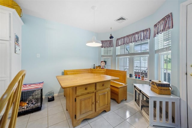 1011 Sunnyfield Ct, Penn Twp Wml, PA 15636 - kitchen featuring light tile patterned flooring, pendant lighting, baseboards, and white cabinetry