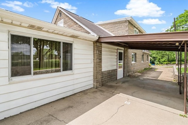 27781/2 Mill St, Hopewell Twp Bea, PA 15001 - view of side of home featuring a carport and concrete driveway