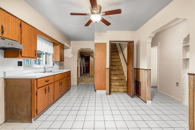 27781/2 Mill St, Hopewell Twp Bea, PA 15001 - kitchen featuring arched walkways, ceiling fan, a sink, light countertops, and brown cabinetry