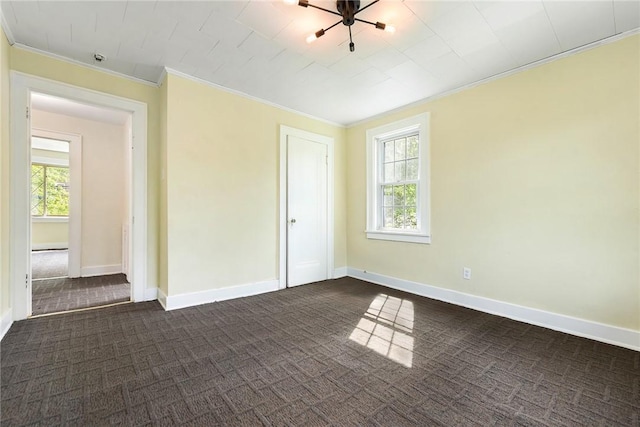 163 Universal Rd, Penn Hills, PA 15235 - spare room with dark colored carpet, crown molding, plenty of natural light, and baseboards