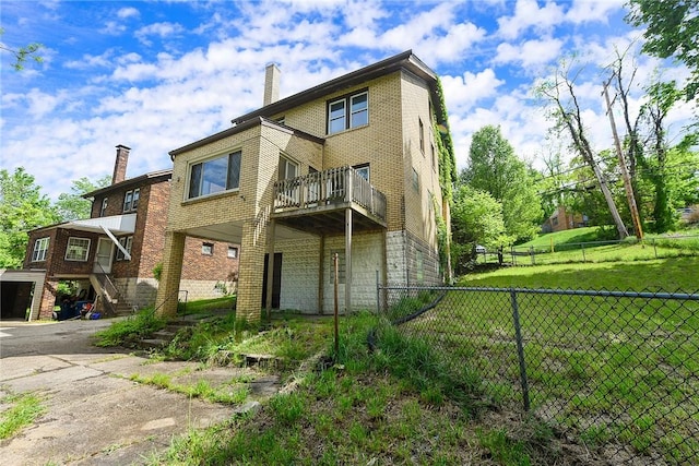 163 Universal Rd, Penn Hills, PA 15235 - rear view of house with a chimney, stairs, and brick siding