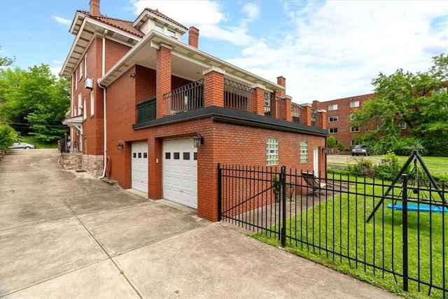 3319 Beechwood Blvd, Squirrel Hill, PA 15217 - view of side of property featuring a balcony, a garage, a chimney, driveway, and brick siding