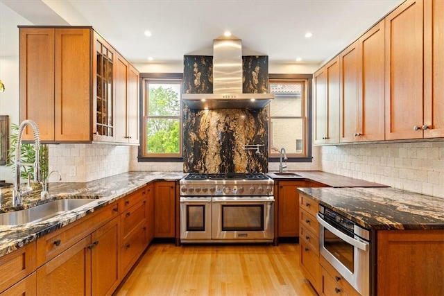 3319 Beechwood Blvd, Squirrel Hill, PA 15217 - kitchen featuring range with two ovens, island range hood, a sink, light wood finished floors, and recessed lighting