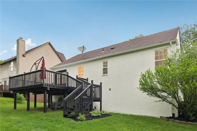 219 Randy Ln, Moon/Crescent Twp, PA 15108 - back of property with a deck, stucco siding, a lawn, and stairway