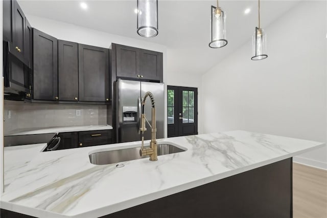 219 Randy Ln, Moon/Crescent Twp, PA 15108 - kitchen with a sink, decorative backsplash, light stone counters, and pendant lighting