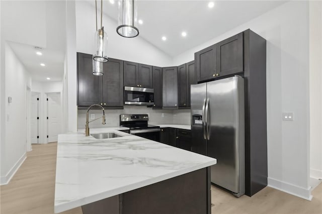 219 Randy Ln, Moon/Crescent Twp, PA 15108 - kitchen featuring stainless steel appliances, a sink, light wood-style flooring, baseboards, and recessed lighting