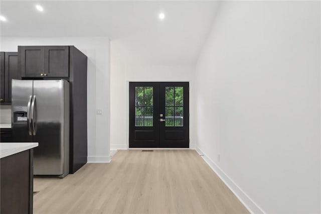 219 Randy Ln, Moon/Crescent Twp, PA 15108 - kitchen featuring stainless steel fridge, light wood-style flooring, french doors, baseboards, and light countertops
