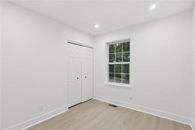 219 Randy Ln, Moon/Crescent Twp, PA 15108 - unfurnished bedroom with baseboards, light wood finished floors, recessed lighting, and a closet