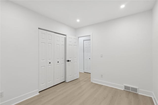 219 Randy Ln, Moon/Crescent Twp, PA 15108 - unfurnished bedroom with light wood finished floors, baseboards, recessed lighting, and a closet