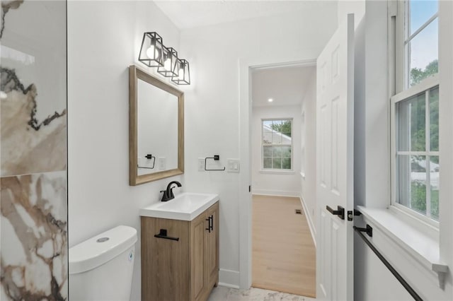 219 Randy Ln, Moon/Crescent Twp, PA 15108 - bathroom featuring vanity, toilet, and baseboards
