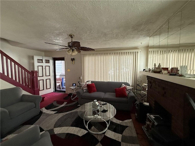 7134 Gladefield St, Lincoln-Larimer, PA 15206 - living area featuring a textured ceiling, stairs, ceiling fan, and carpet