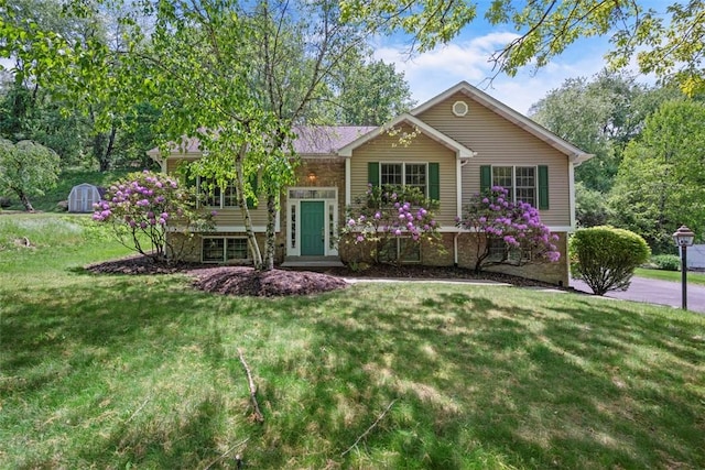 10276 Rinaman Rd, Mccandless, PA 15090 - raised ranch featuring a front yard and stone siding