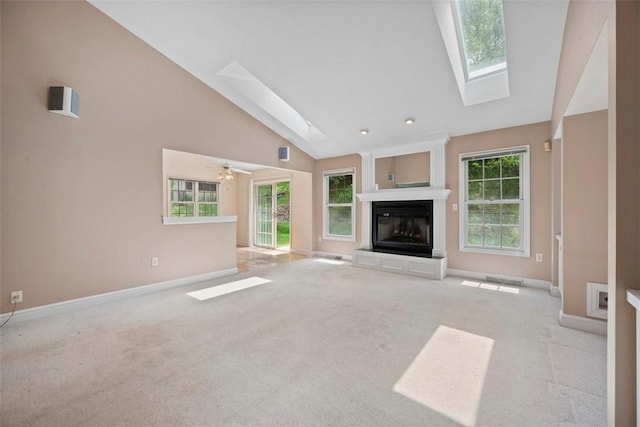 10276 Rinaman Rd, Mccandless, PA 15090 - unfurnished living room with a skylight, baseboards, carpet floors, and high vaulted ceiling