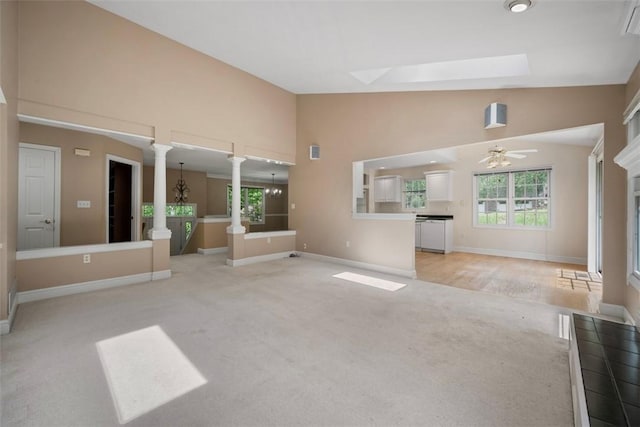 10276 Rinaman Rd, Mccandless, PA 15090 - unfurnished living room featuring light carpet, decorative columns, high vaulted ceiling, baseboards, and ceiling fan