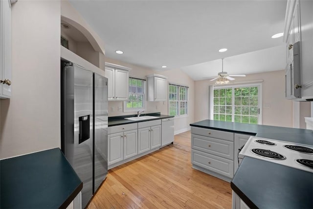 10276 Rinaman Rd, Mccandless, PA 15090 - kitchen featuring stainless steel fridge with ice dispenser, dishwashing machine, dark countertops, a sink, and light wood-style floors
