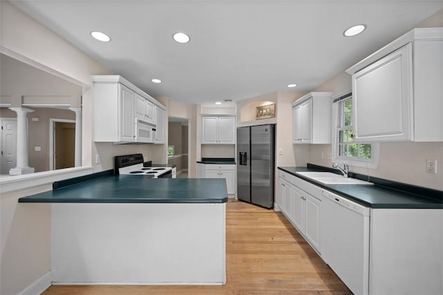10276 Rinaman Rd, Mccandless, PA 15090 - kitchen featuring white appliances, dark countertops, a sink, a peninsula, and recessed lighting