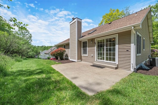 10276 Rinaman Rd, Mccandless, PA 15090 - rear view of house featuring a chimney, a yard, a patio area, central air condition unit, and roof with shingles