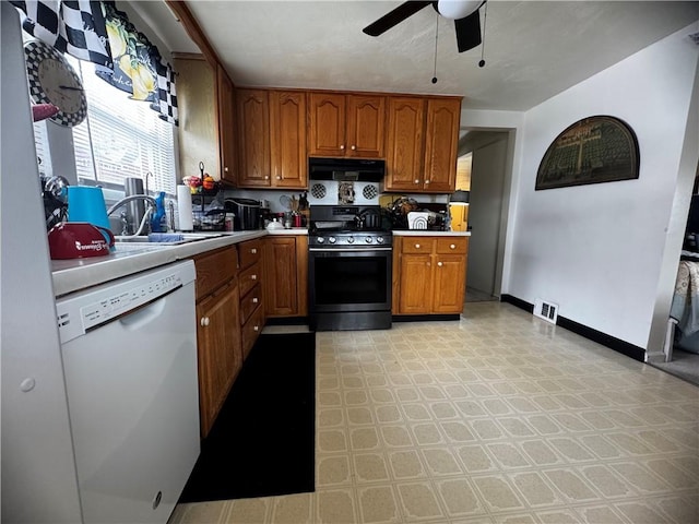 5 Barton Dr, Churchill Boro, PA 15221 - kitchen featuring gas stove, white dishwasher, range hood, a sink, and a ceiling fan