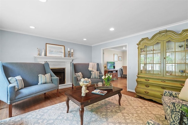 1544 Eldorado Dr, Hopewell Twp Bea, PA 15001 - living area featuring wood finished floors, crown molding, recessed lighting, a fireplace with raised hearth, and baseboards