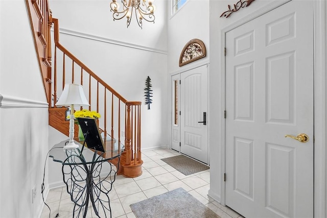 1544 Eldorado Dr, Hopewell Twp Bea, PA 15001 - tiled entryway with a chandelier, stairs, and a towering ceiling