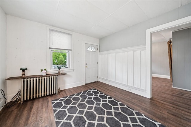 507 Sells Ln, Hempfield Twp Wml, PA 15601 - foyer entrance with radiator heating unit, wood finished floors, and baseboards