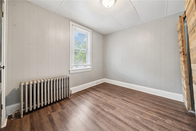 507 Sells Ln, Hempfield Twp Wml, PA 15601 - spare room featuring radiator, wood finished floors, and baseboards