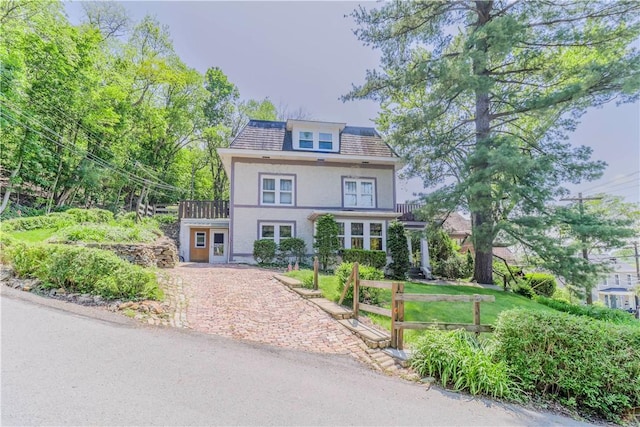 136 E Crafton Ave, Crafton, PA 15205 - view of front of house with stucco siding and a balcony
