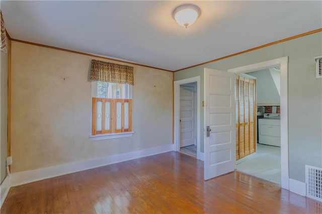 136 E Crafton Ave, Crafton, PA 15205 - spare room with washer / clothes dryer, wood finished floors, ornamental molding, and baseboards