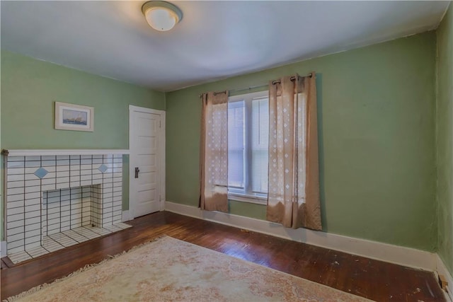 136 E Crafton Ave, Crafton, PA 15205 - unfurnished room with wood finished floors, baseboards, and a tiled fireplace