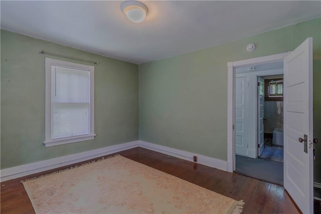 136 E Crafton Ave, Crafton, PA 15205 - empty room with dark wood finished floors, baseboards, and a smoke detector
