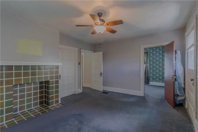 136 E Crafton Ave, Crafton, PA 15205 - unfurnished living room with carpet floors, a ceiling fan, baseboards, and a tiled fireplace