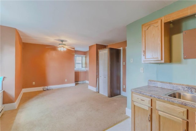 136 E Crafton Ave, Crafton, PA 15205 - kitchen featuring light brown cabinets, a baseboard radiator, a ceiling fan, and light carpet