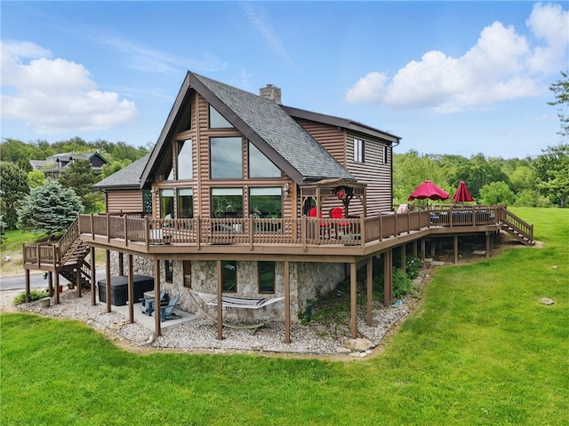 395 Lynn Portal Rd, Mount Pleasant Twp Was, PA 15301 - rear view of house featuring a hot tub, a wooden deck, stairway, a chimney, and a lawn