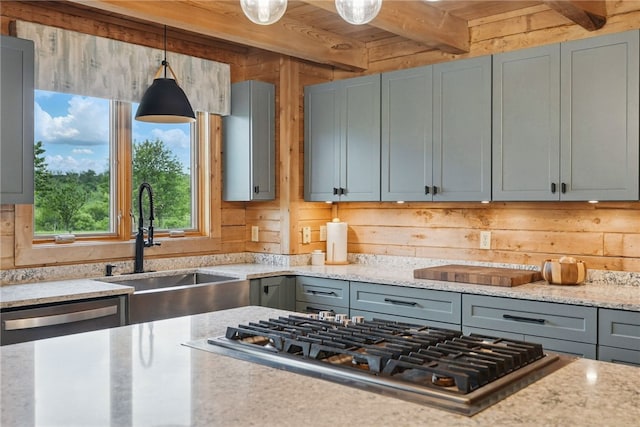 395 Lynn Portal Rd, Mount Pleasant Twp Was, PA 15301 - kitchen featuring appliances with stainless steel finishes, a sink, beamed ceiling, decorative light fixtures, and light stone counters