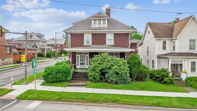 301 W Patriot St, Somerset Boro, PA 15501 - traditional style home with brick siding, a chimney, and a residential view