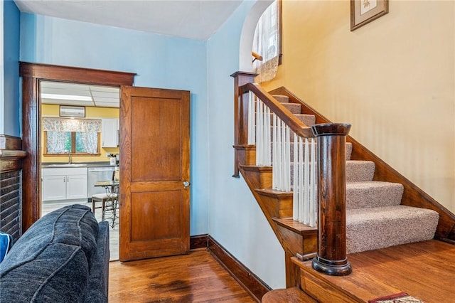 301 W Patriot St, Somerset Boro, PA 15501 - stairs featuring wood finished floors, baseboards, and arched walkways