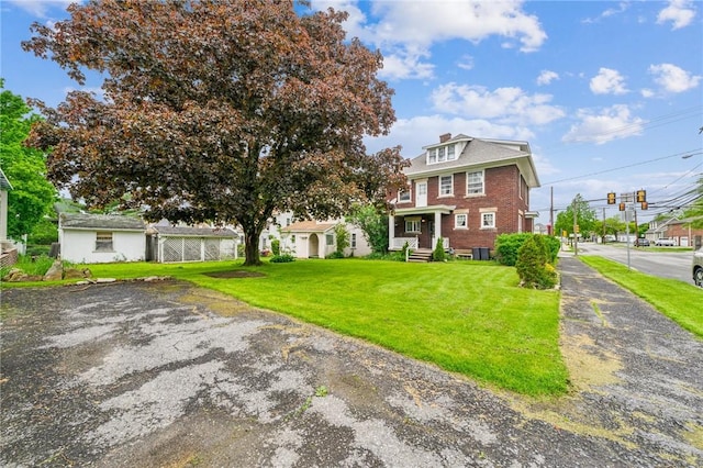 301 W Patriot St, Somerset Boro, PA 15501 - american foursquare style home featuring a front lawn and brick siding