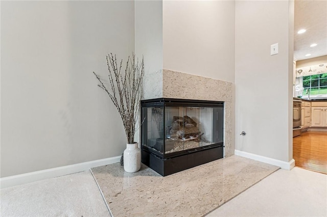 8201 Club Side Dr, Adams Twp, PA 16046 - detailed view of a fireplace, recessed lighting, baseboards, and stove