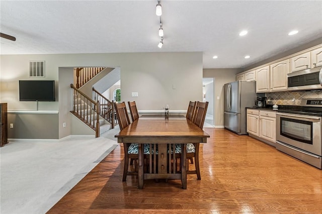 8201 Club Side Dr, Adams Twp, PA 16046 - dining space featuring light wood-style flooring, stairs, baseboards, and recessed lighting